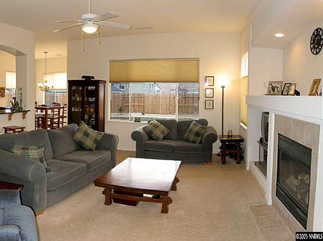 2595 Perryville Drive Reno, NV 89521 - Photo 2 of 9 a living room with furniture and a fireplace