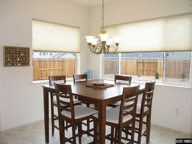 2595 Perryville Drive Reno, NV 89521 - Photo 5 of 9 a view of a dining room with furniture a chandelier and wooden floor