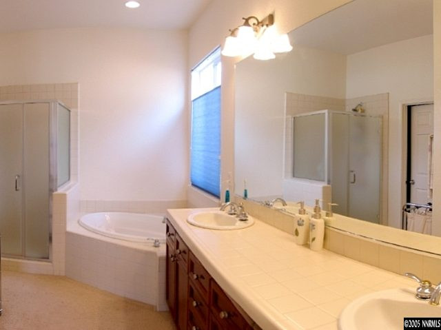 2595 Perryville Drive Reno, NV 89521 - Photo 9 of 9 a bathroom with a tub sink and a mirror