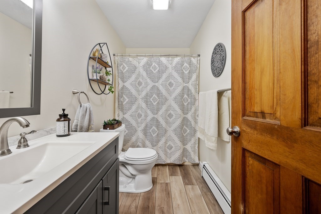 152 Warren Road Brimfield, MA 01010 - Photo 13 of 33 a bathroom with a sink and a mirror
