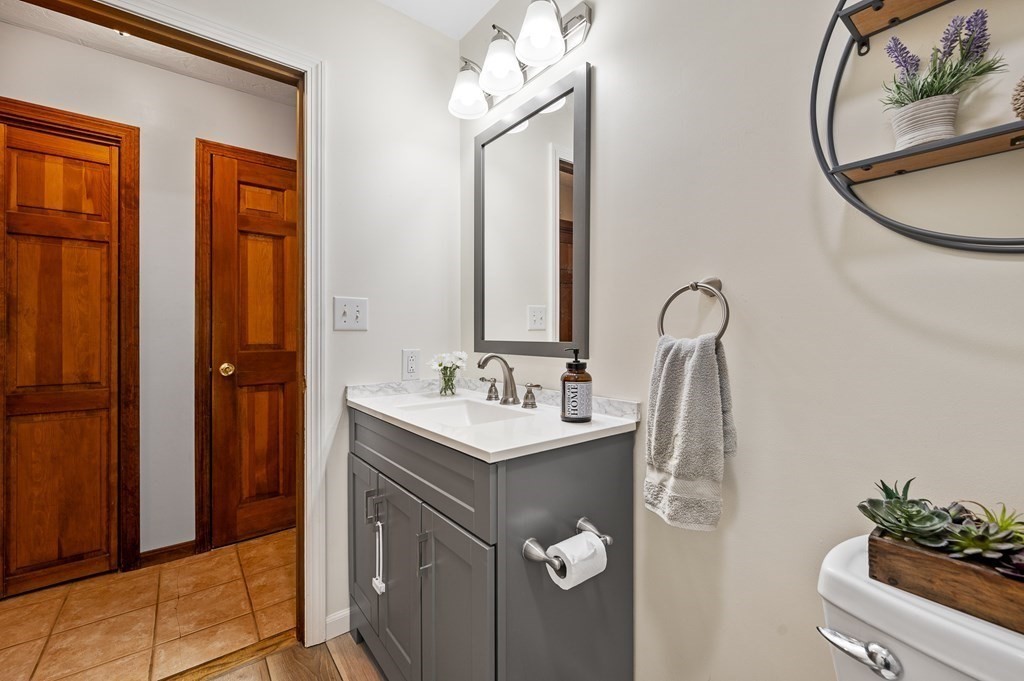 152 Warren Road Brimfield, MA 01010 - Photo 14 of 33 a bathroom with a sink and a mirror