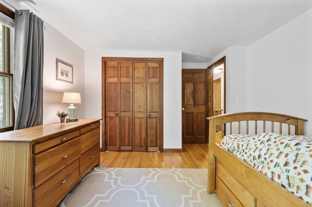152 Warren Road Brimfield, MA 01010 - Photo 18 of 33 a bedroom with a bed and a dresser