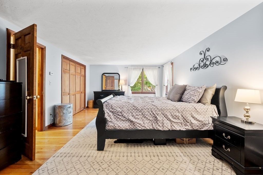 152 Warren Road Brimfield, MA 01010 - Photo 22 of 33 a bedroom with a large bed and a window