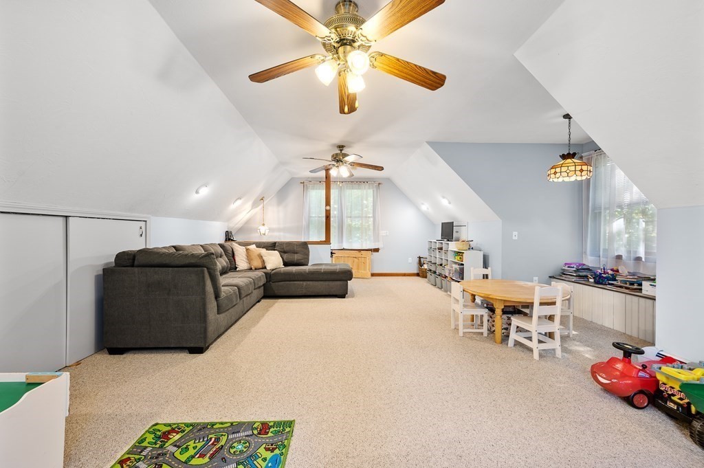 152 Warren Road Brimfield, MA 01010 - Photo 25 of 33 a living room with furniture and kitchen chandelier