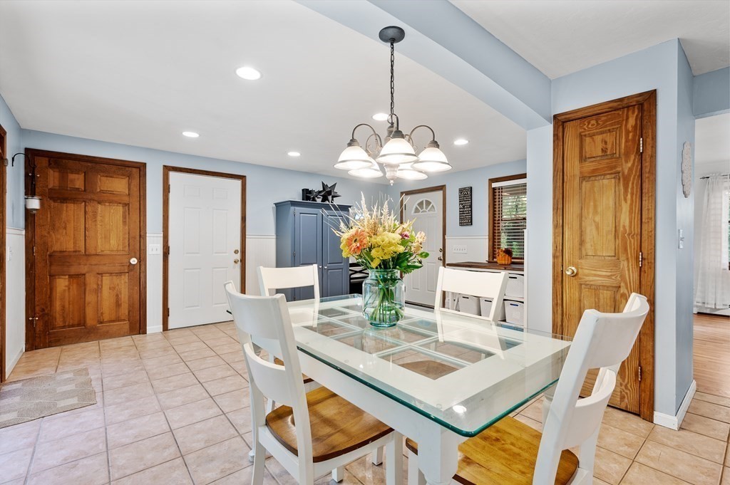 152 Warren Road Brimfield, MA 01010 - Photo 4 of 33 a view of a dining room with furniture a chandelier and wooden floor
