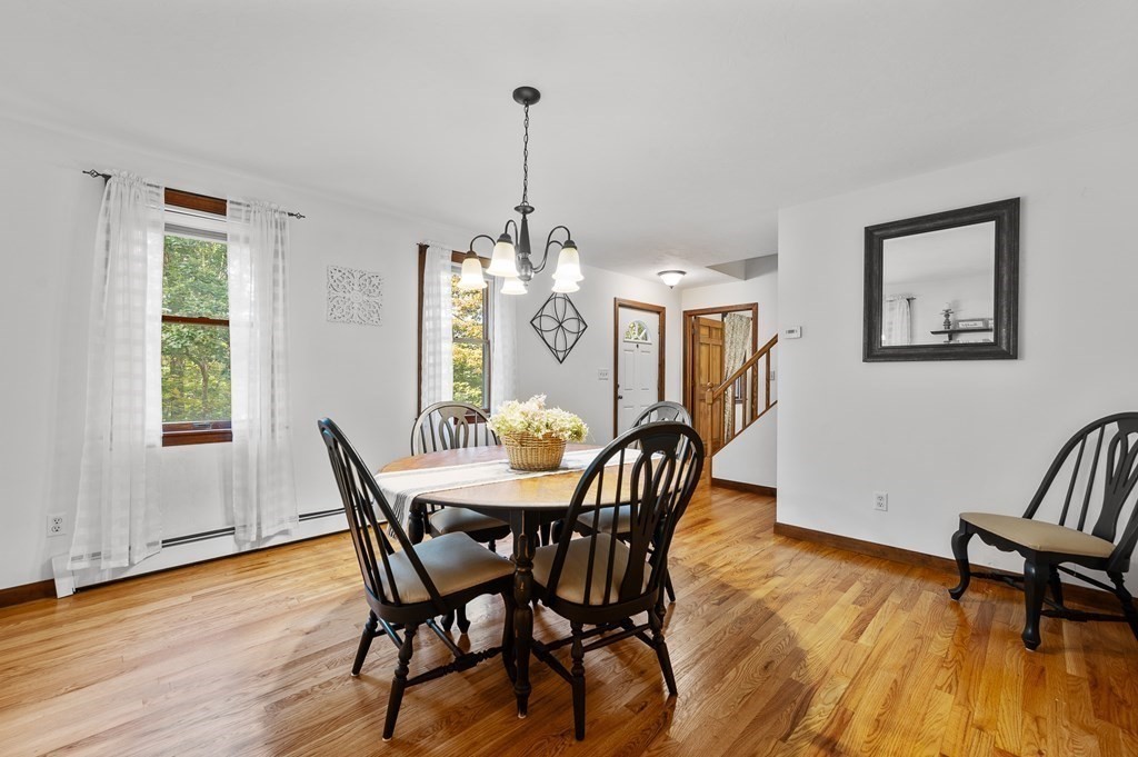 152 Warren Road Brimfield, MA 01010 - Photo 8 of 33 a view of a dining room with furniture window and wooden floor