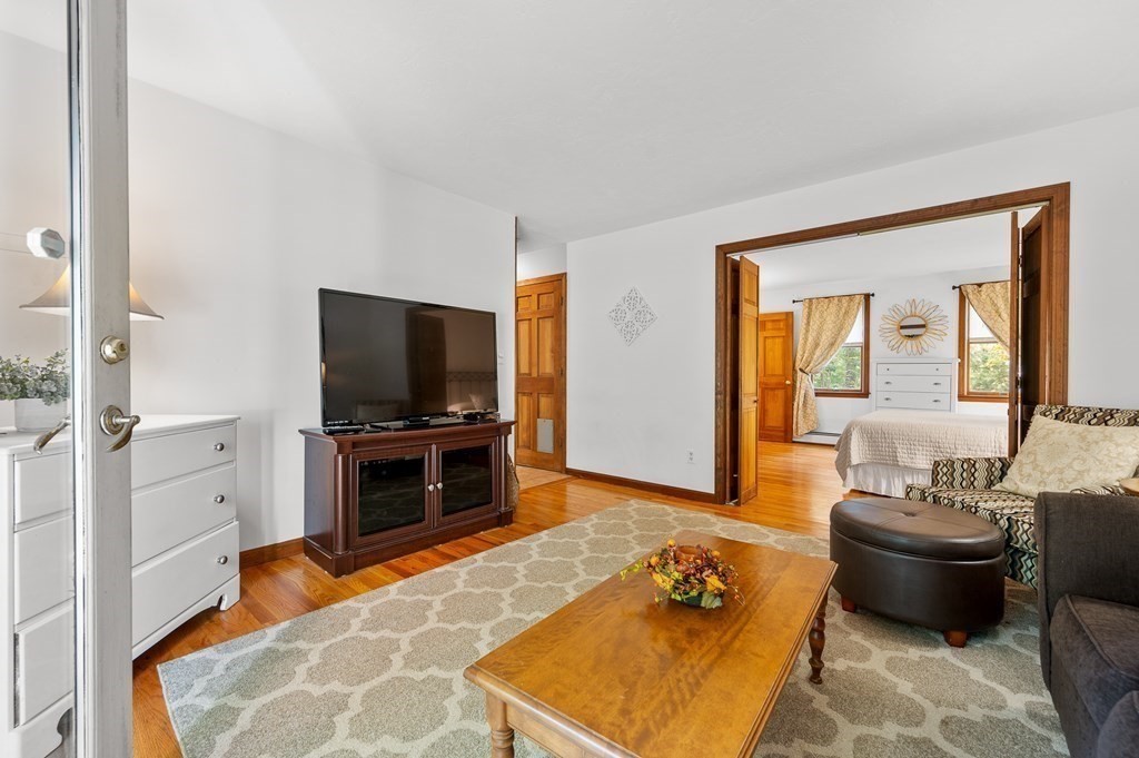 152 Warren Road Brimfield, MA 01010 - Photo 10 of 33 a living room with a couch and a flat screen tv