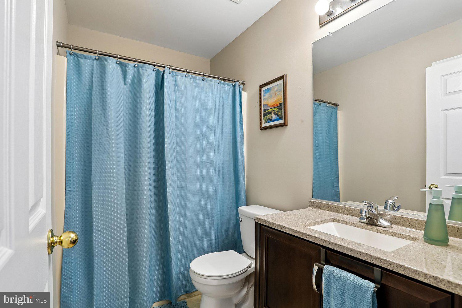 2530 Carrington Way Frederick, MD 21702 - Photo 25 of 38 a bathroom with a granite countertop sink toilet and a mirror