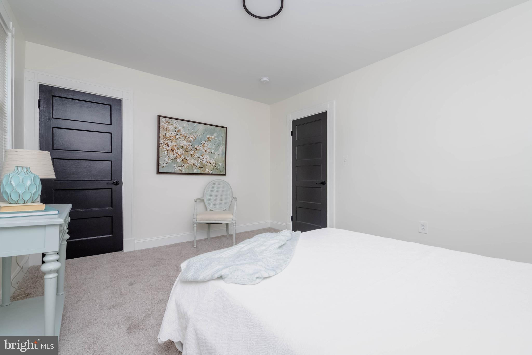 1117 Overbrook Road Baltimore, MD 21239 - Photo 22 of 37 a bedroom with a bed and a cabinets