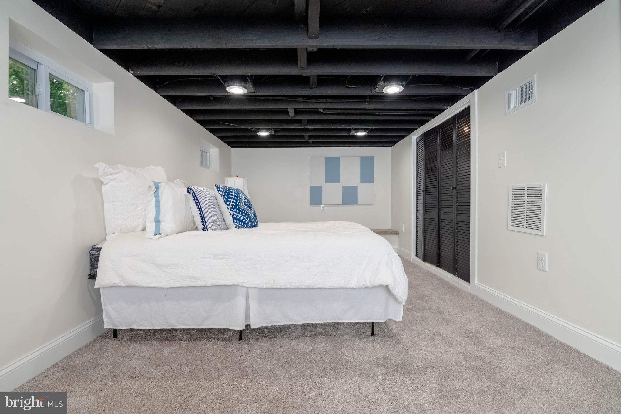 1117 Overbrook Road Baltimore, MD 21239 - Photo 29 of 37 a large bed sitting in a room