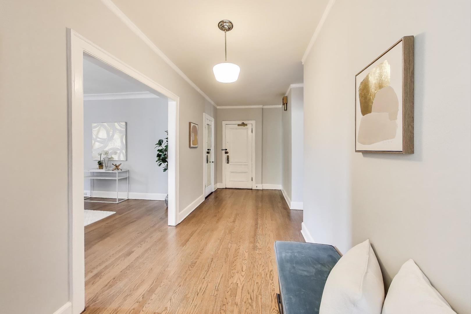 1755 East 55th Street, Unit 1204 Chicago, IL 60615 - Photo 4 of 19 a view of livingroom with furniture and wooden floor