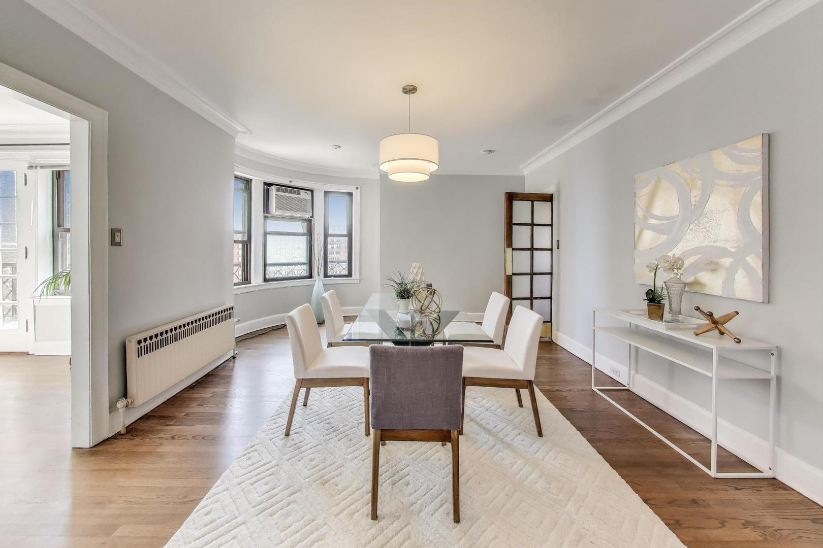 1755 East 55th Street, Unit 1204 Chicago, IL 60615 - Photo 7 of 19 a view of a dining room with furniture window and wooden floor