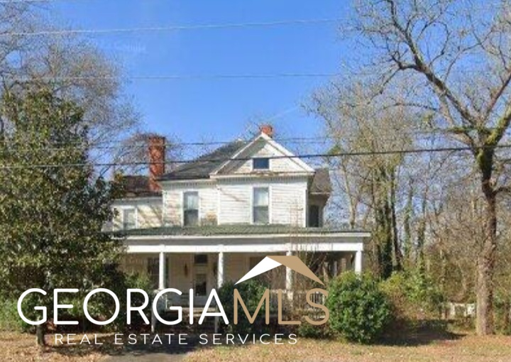 365 Covington Street Jackson, GA 30233 - Photo 1 of 1 a front view of a house with a yard