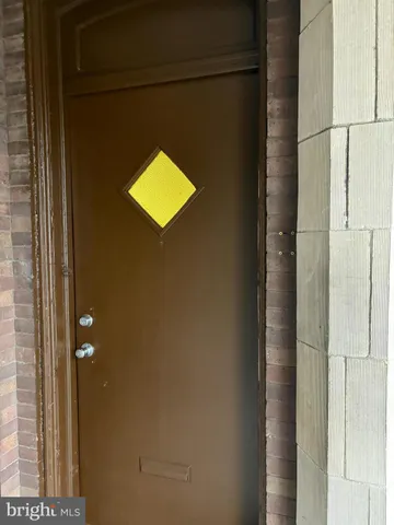 a bathroom with a light fixture and a shower