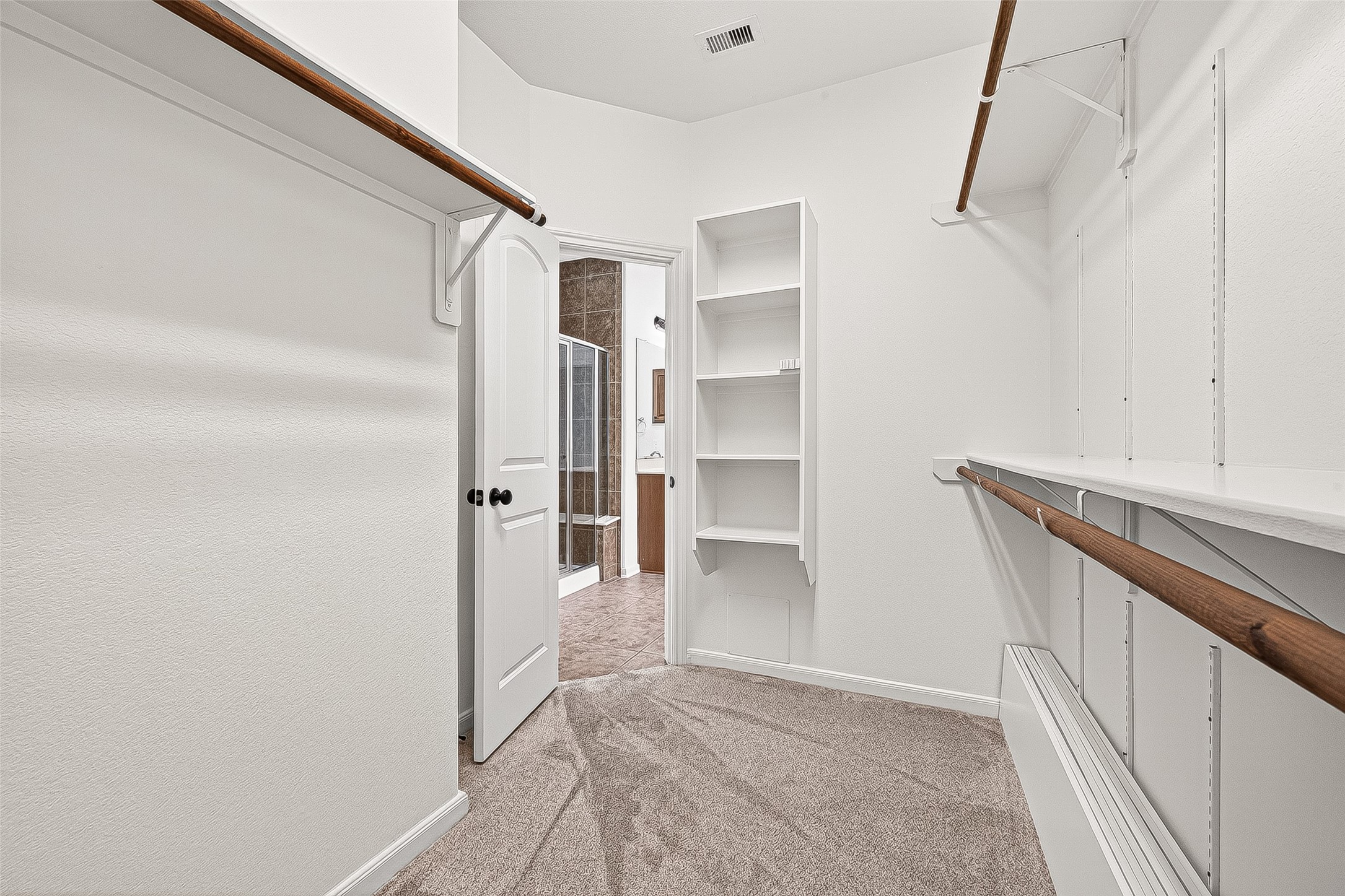 138 South Sawbridge Circle Spring, TX 77389 - Photo 22 of 37 a view of walk in closet with empty racks