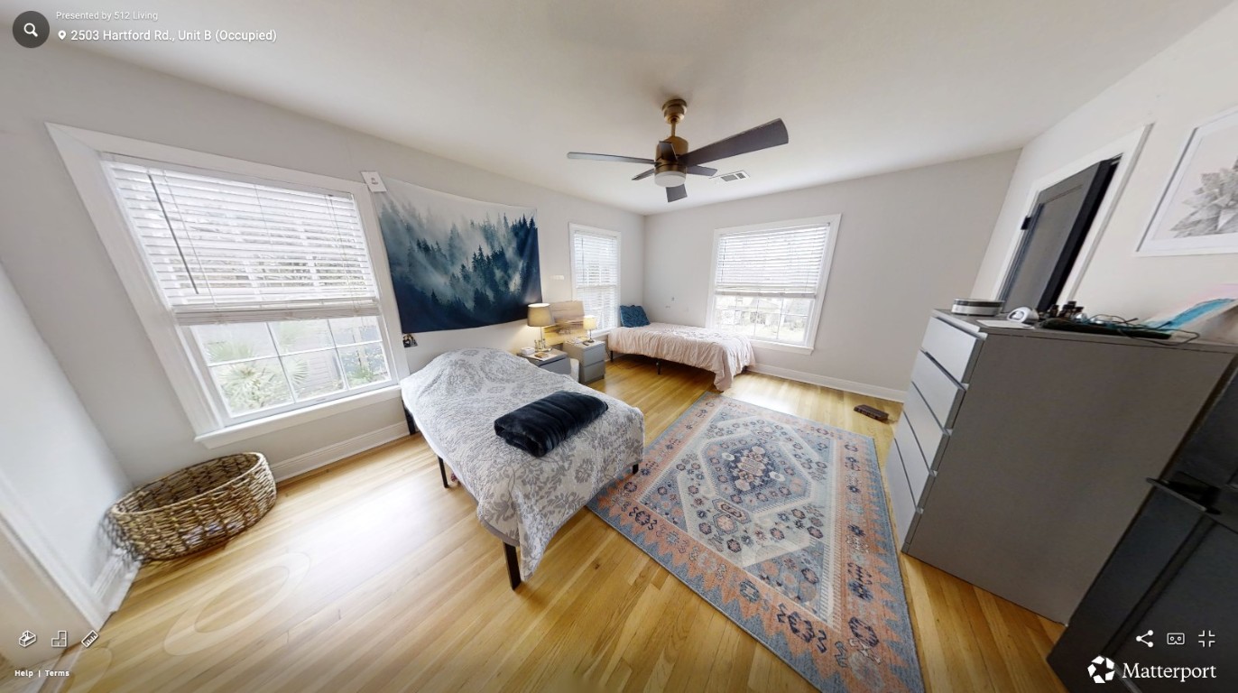 2503 Hartford Road, Unit B Austin, TX 78703 - Photo 6 of 14 Bedroom with light wood finished floors and ceiling fan