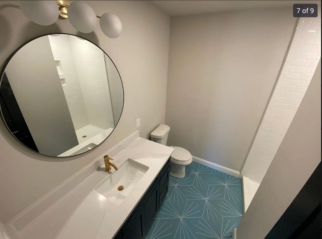 2503 Hartford Road, Unit B Austin, TX 78703 - Photo 10 of 14 Bathroom with vanity and dark tile patterned floors