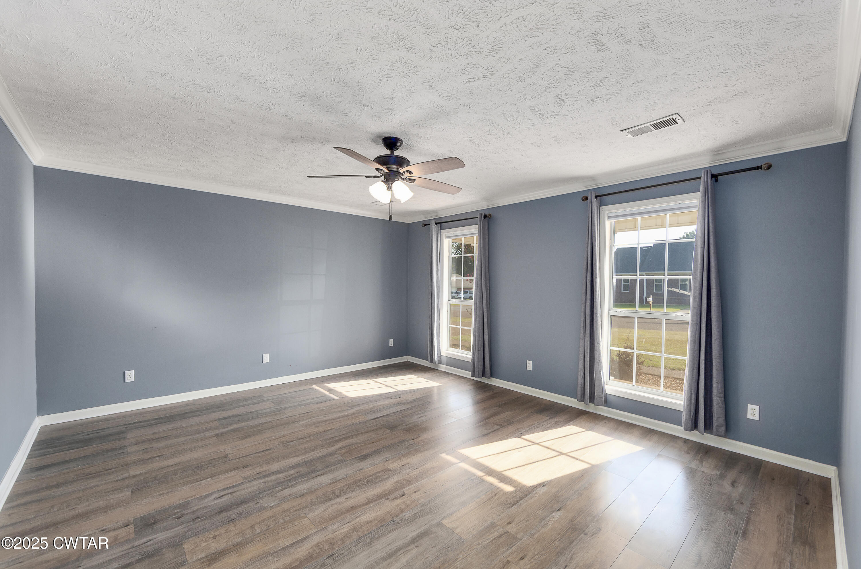 175 Willow Branch Drive Jackson, TN 38305 - Photo 19 of 39 a view of an empty room with a window and wooden floor