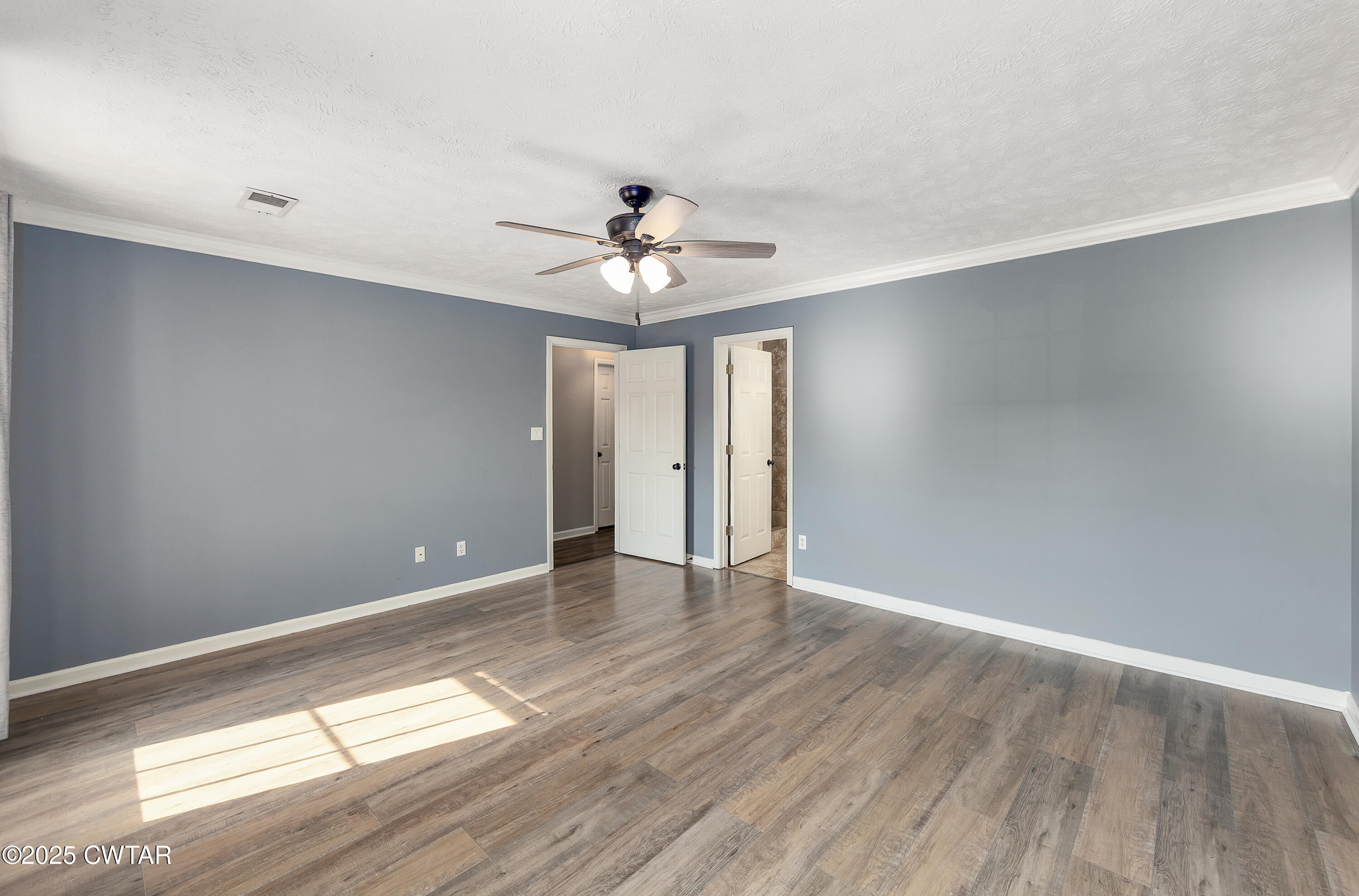 175 Willow Branch Drive Jackson, TN 38305 - Photo 20 of 39 a view of an empty room with window and wooden floor
