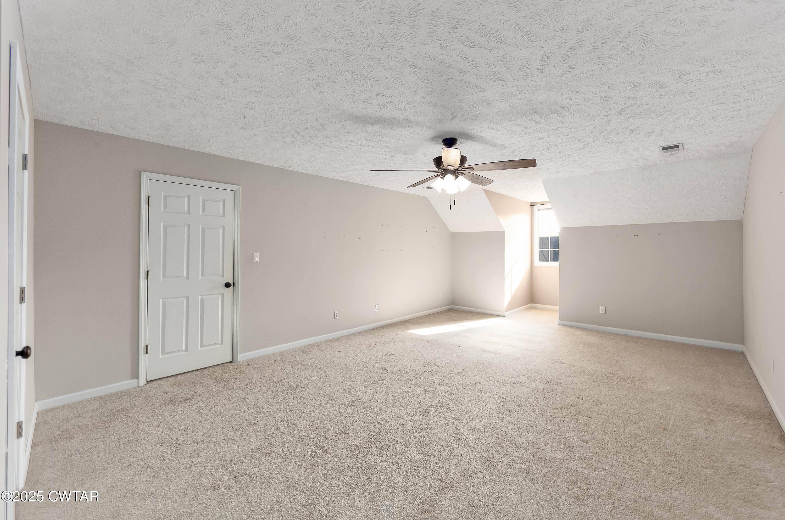 175 Willow Branch Drive Jackson, TN 38305 - Photo 30 of 39 a view of a big room with chandelier fan and windows