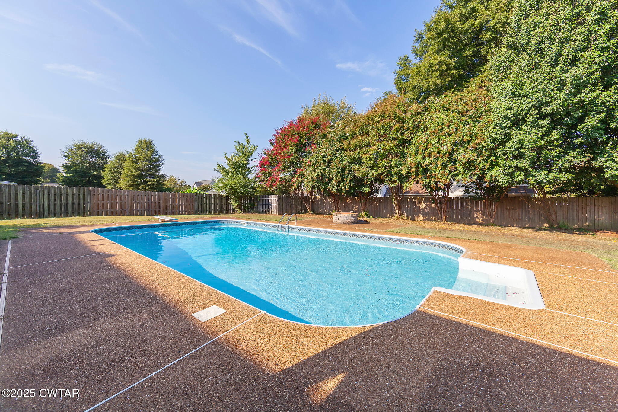 175 Willow Branch Drive Jackson, TN 38305 - Photo 34 of 39 a view of a swimming pool with an outdoor space and seating area