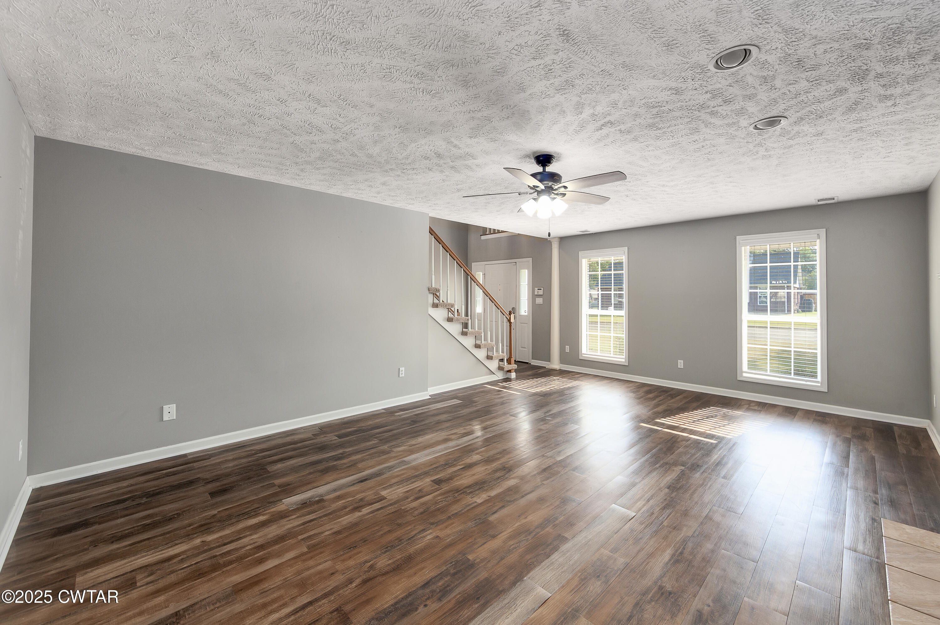 175 Willow Branch Drive Jackson, TN 38305 - Photo 6 of 39 a view of an empty room with wooden floor and a window
