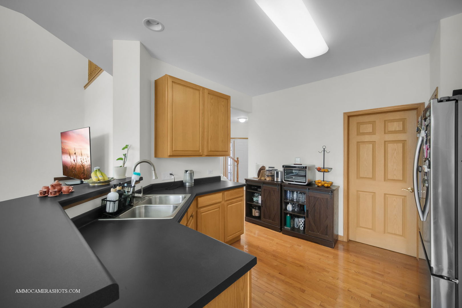 369 Vaughn Circle Aurora, IL 60502 - Photo 12 of 39 a kitchen with a sink stove and refrigerator