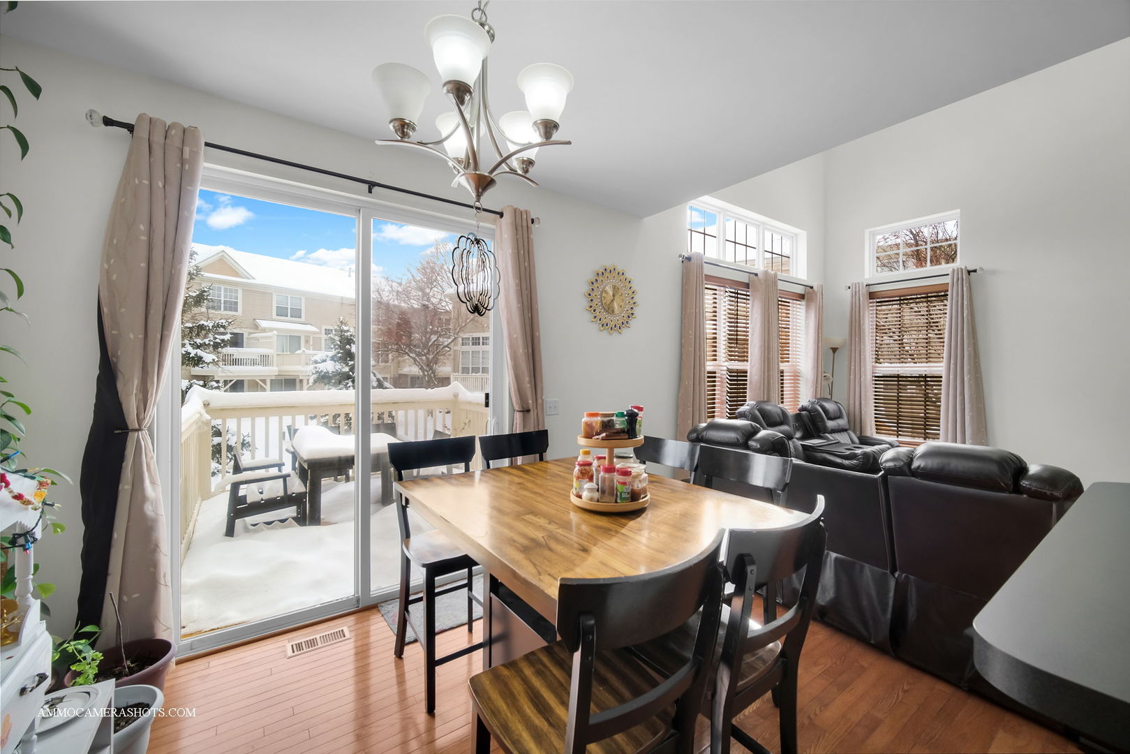 369 Vaughn Circle Aurora, IL 60502 - Photo 16 of 39 a view of a dining room with furniture window and wooden floor