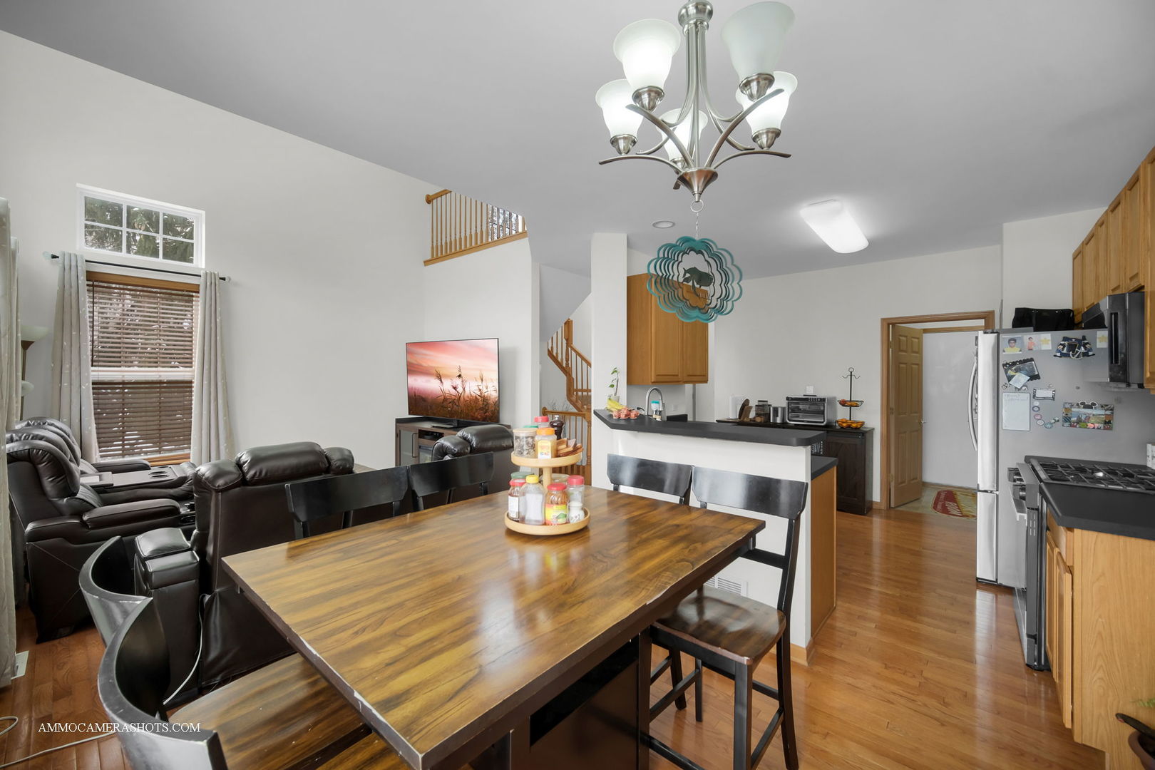 369 Vaughn Circle Aurora, IL 60502 - Photo 17 of 39 a view of a dining room with furniture and wooden floor