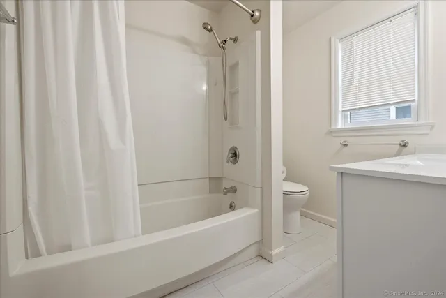 a bathroom with a bathtub and a sink