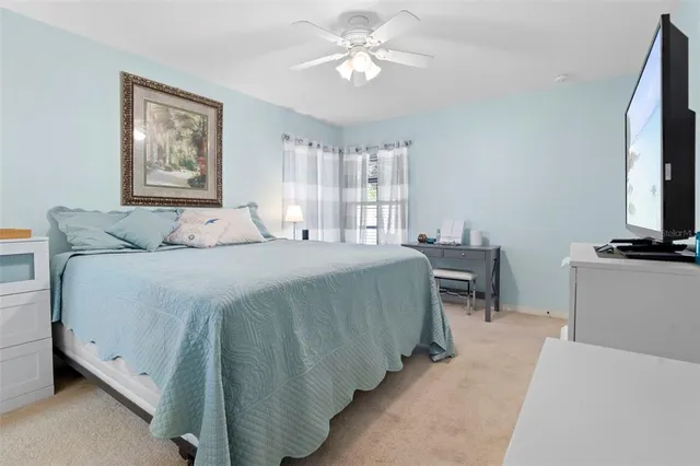 a living room with a toilet a sink and a window
