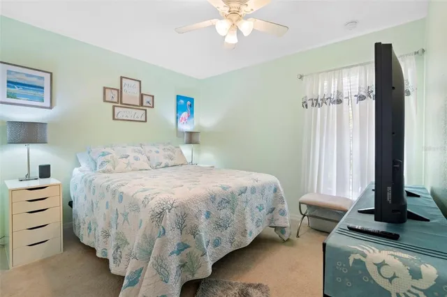 a bedroom with a bed and a rug