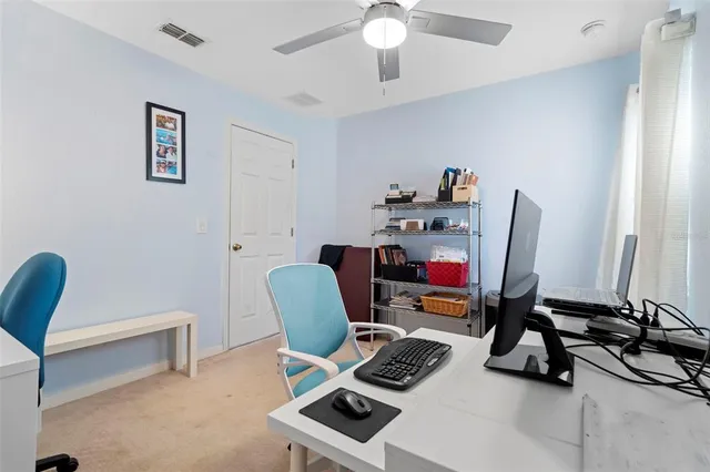 a workspace with furniture and a lamp