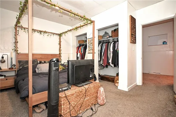 a view of an entryway with wooden floor