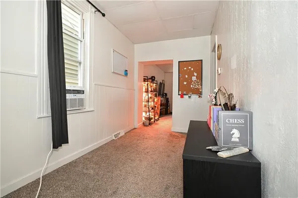 a kitchen with stainless steel appliances granite countertop a sink a stove cabinets and wooden floor
