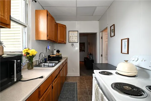 a view of an entryway with workspace and bedroom