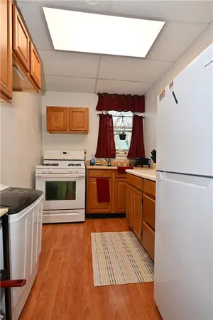 a kitchen with stainless steel appliances a stove a sink and a refrigerator