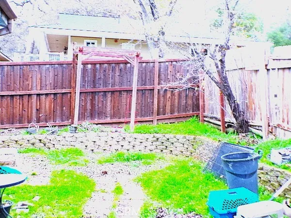 a view of a backyard with sitting area