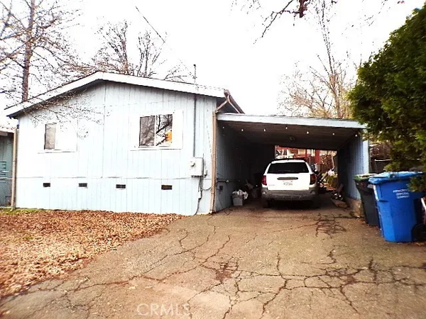 a side view of a house with a yard