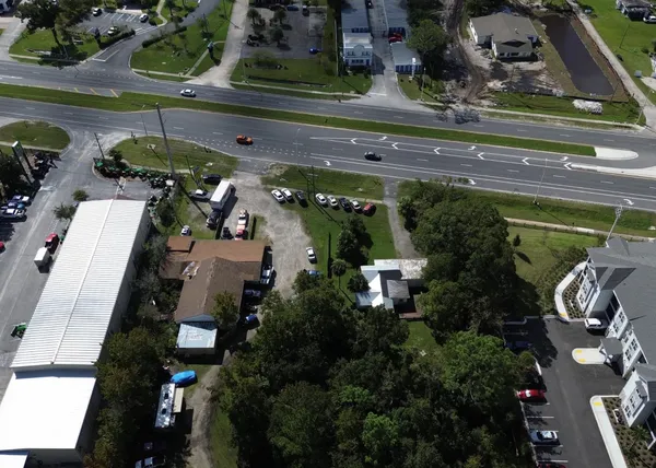 a view of a street with cars on road