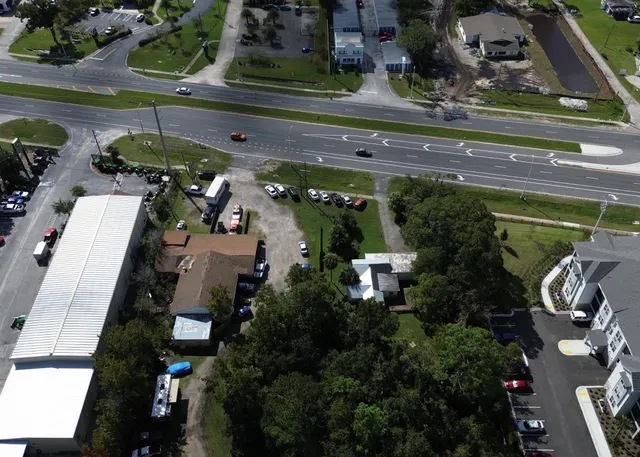 a view of a street with cars on road