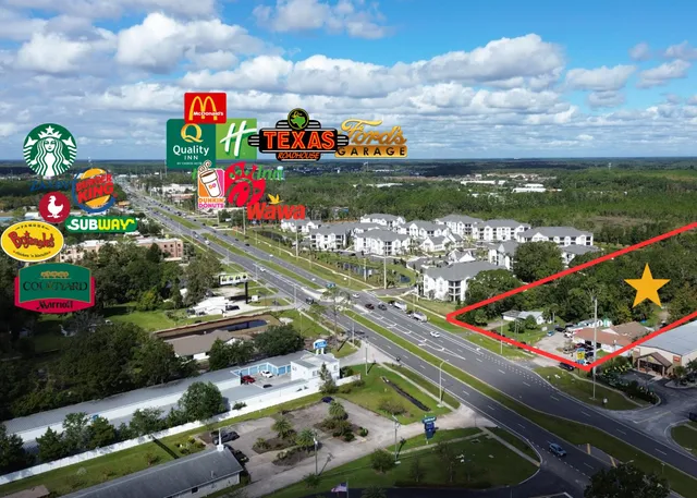an aerial view of house with yard swimming pool and outdoor seating