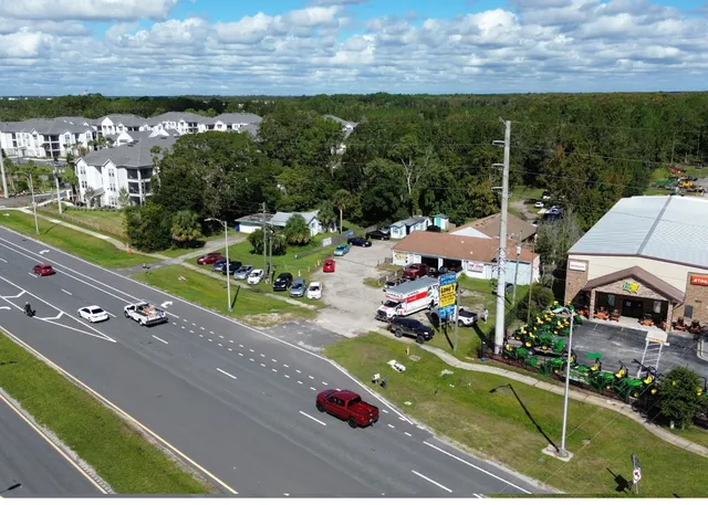 a view of a town with floor to ceiling windows