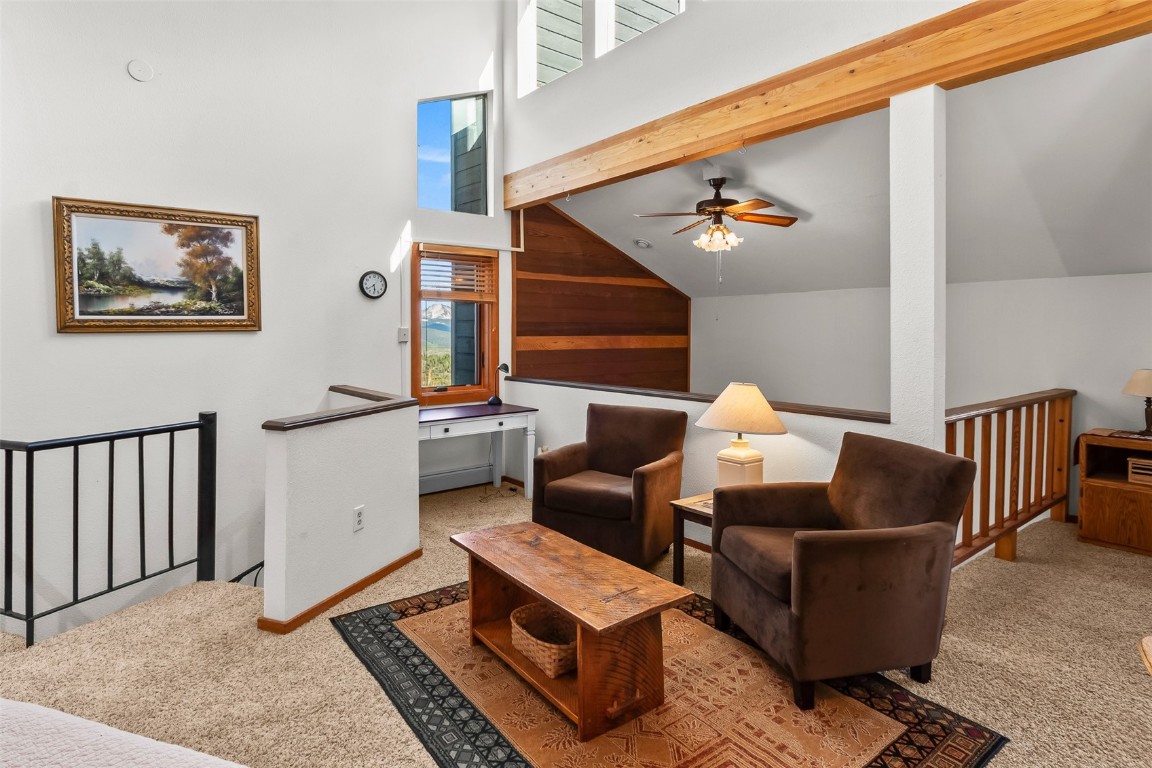 9430 Ryan Gulch Road, Unit 9453 Silverthorne, CO 80498 - Photo 16 of 28 a living room with furniture and wooden floor