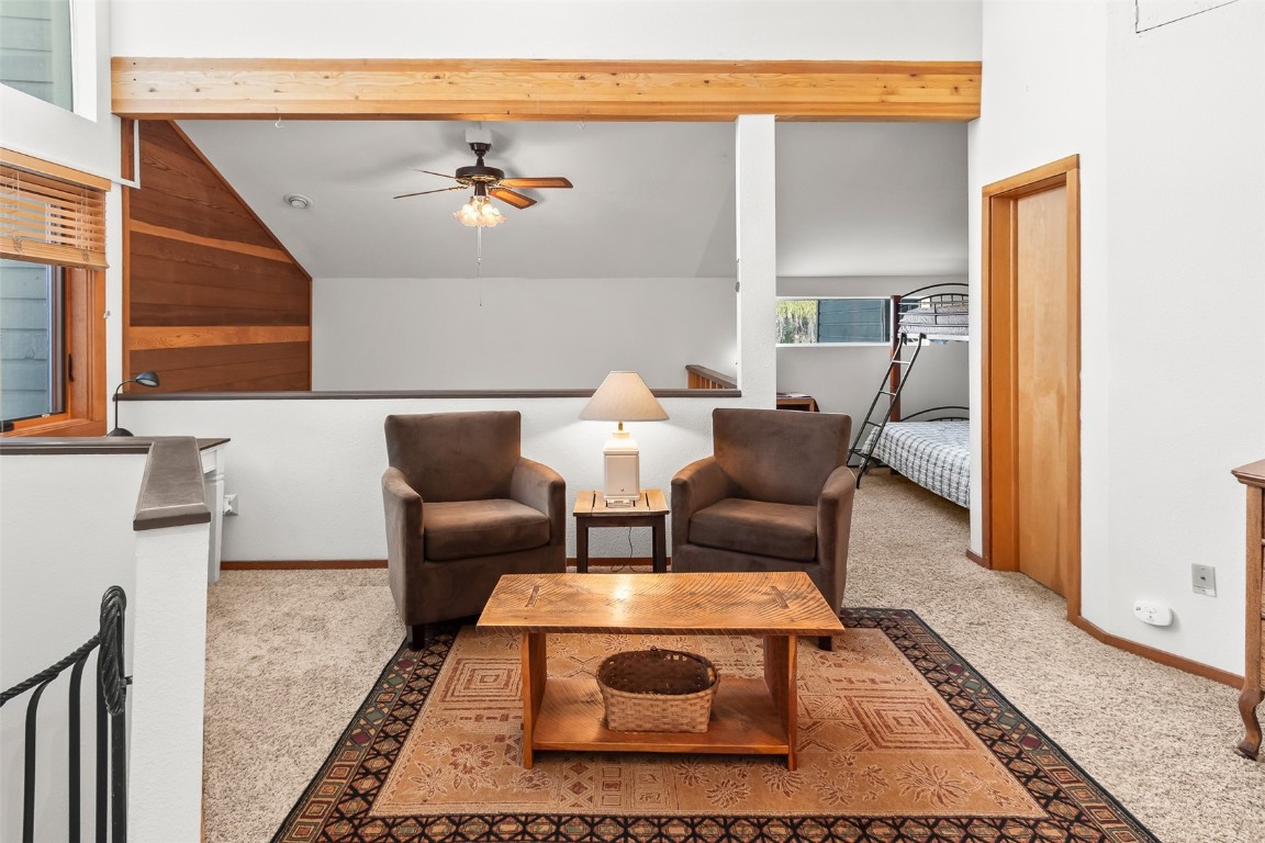 9430 Ryan Gulch Road, Unit 9453 Silverthorne, CO 80498 - Photo 17 of 28 a living room with furniture and a rug