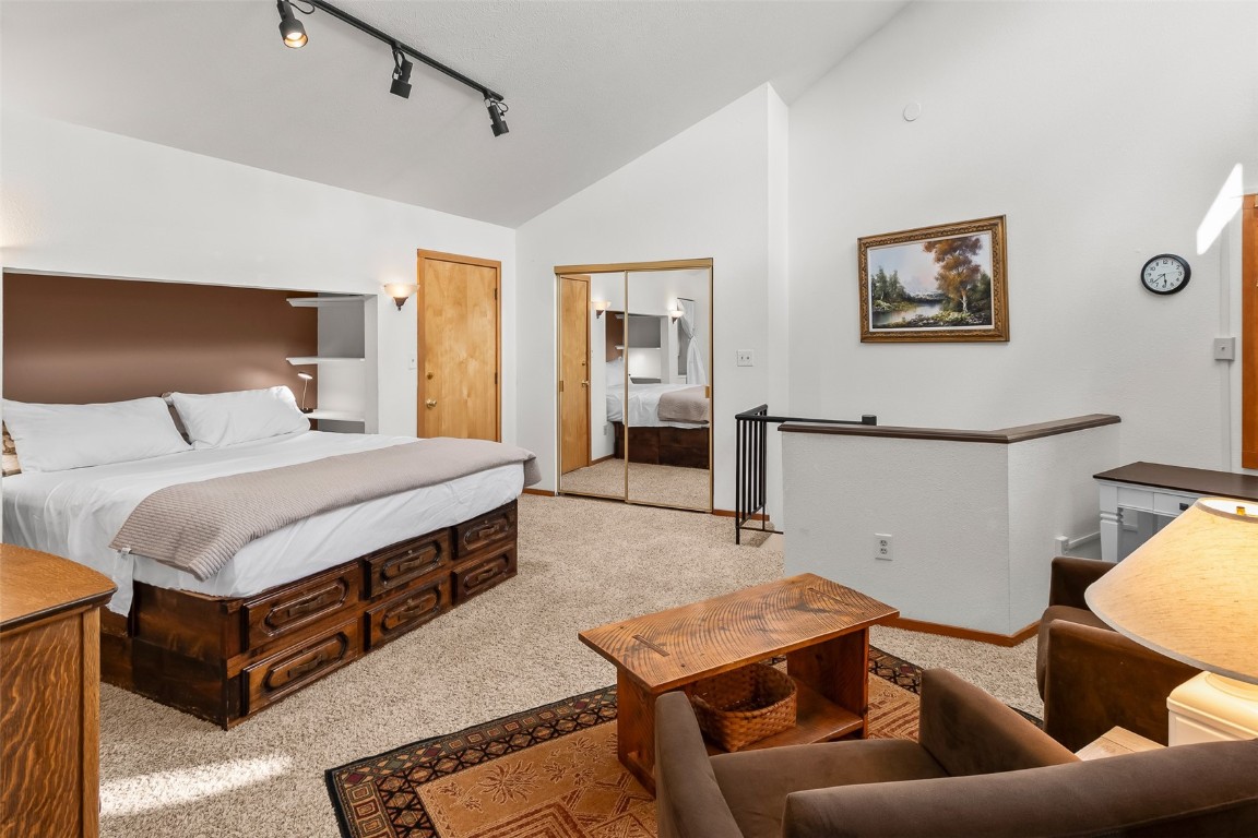 9430 Ryan Gulch Road, Unit 9453 Silverthorne, CO 80498 - Photo 20 of 28 a bedroom with a bed and window