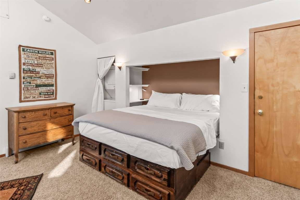 9430 Ryan Gulch Road, Unit 9453 Silverthorne, CO 80498 - Photo 21 of 28 a bedroom with a bed and a window