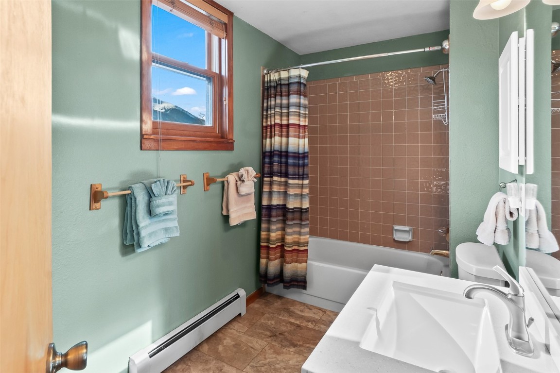 9430 Ryan Gulch Road, Unit 9453 Silverthorne, CO 80498 - Photo 25 of 28 a bathroom with a sink and a shower