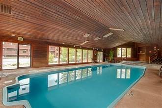 9430 Ryan Gulch Road, Unit 9453 Silverthorne, CO 80498 - Photo 27 of 28 a view of a swimming pool with a patio