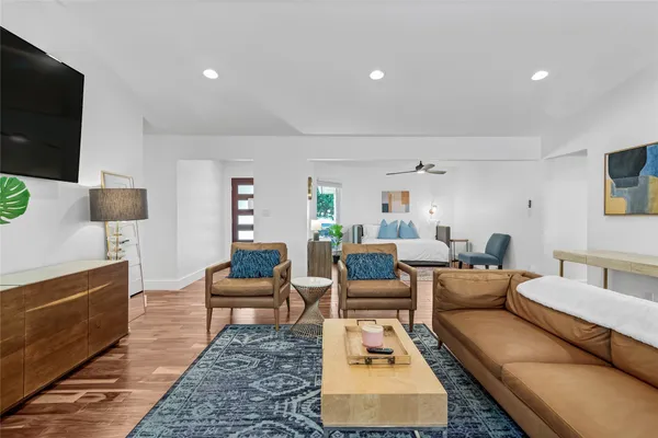 a view of a dining room with furniture and wooden floor